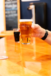 Hand holding a beer